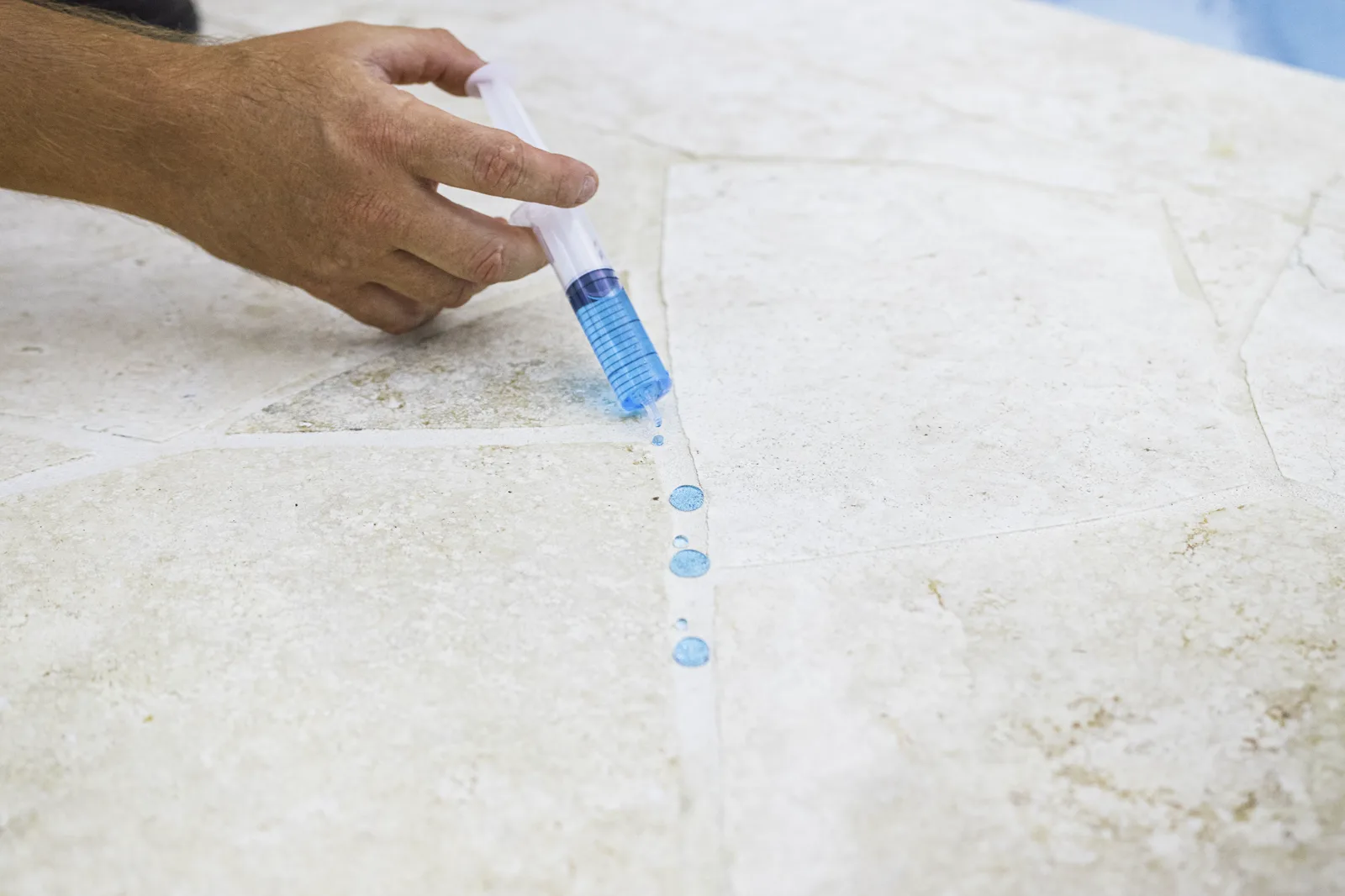 Dyed water beading on sealed travertine, MineralProtect repellency